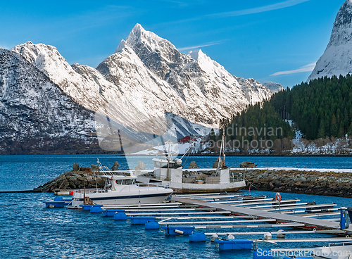 Image of Beautiful marina surrounded by snow-capped mountains and clear b