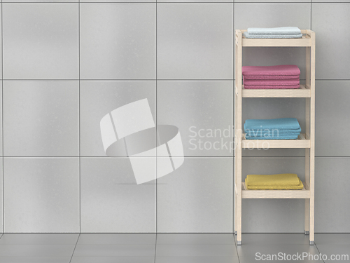 Image of Wooden shelving unit with towels