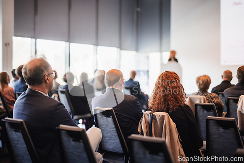 Image of Woman giving presentation on business conference event.