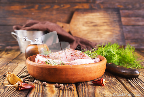Image of raw steak with aroma spice and salt