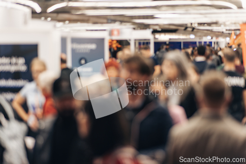 Image of Abstract blurred people at exhibition hall of expo event trade show. Business convention show or job fair. Business concept background.