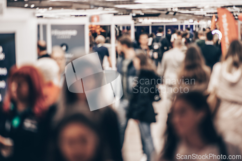 Image of Abstract blurred people at exhibition hall of expo event trade show. Business convention show or job fair. Business concept background.