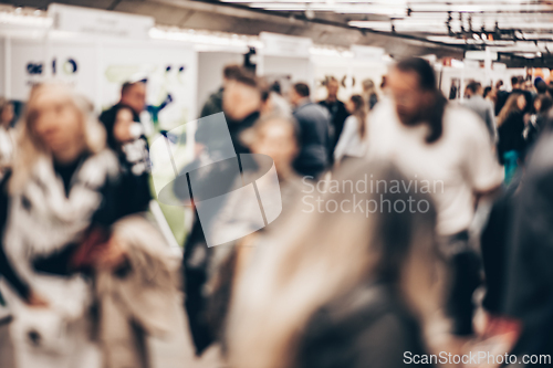 Image of Abstract blurred people at exhibition hall of expo event trade show. Business convention show or job fair. Business concept background.