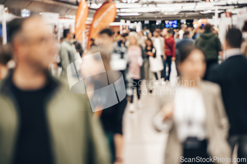 Image of Abstract blurred people at exhibition hall of expo event trade show. Business convention show or job fair. Business concept background.