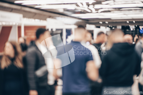 Image of Abstract blurred people at exhibition hall of expo event trade show. Business convention show or job fair. Business concept background.