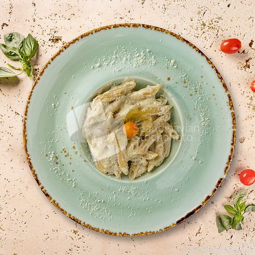 Image of Delicious penne pasta with cheese sauce