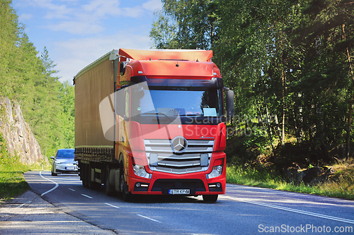 Image of Red Mercedes-Benz Actros Truck Semi Trailer on Road