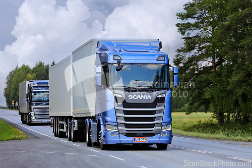 Image of Scania S500 and Volvo FH Freight Trucks on Road