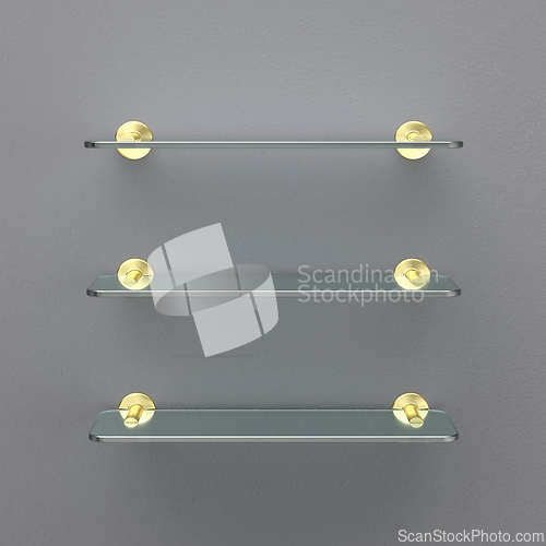 Image of Empty glass shelves with golden brackets