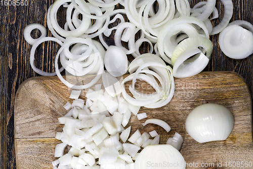 Image of ripe onions sliced on a Board