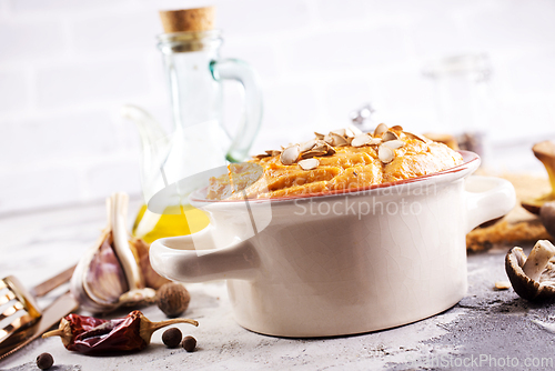 Image of Vegetarian autumn pumpkin cream soup with mushrooms and seeds
