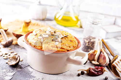 Image of Vegetarian autumn pumpkin cream soup with mushrooms and seeds