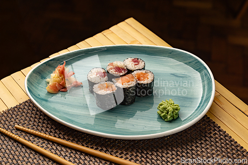 Image of Delicious tuna and salmon hosomaki rolls
