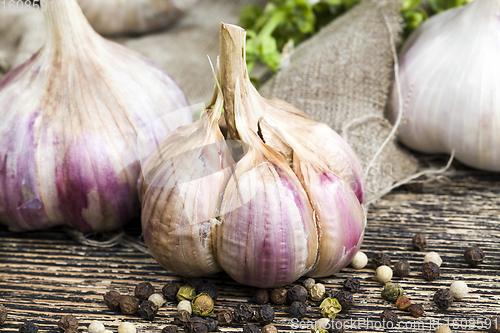 Image of peeling ripe garlic