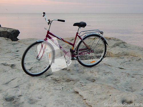 Image of Bicycle on the rocky coast of the sea.
