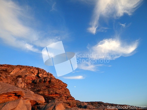 Image of Coastal cliff at sunset.