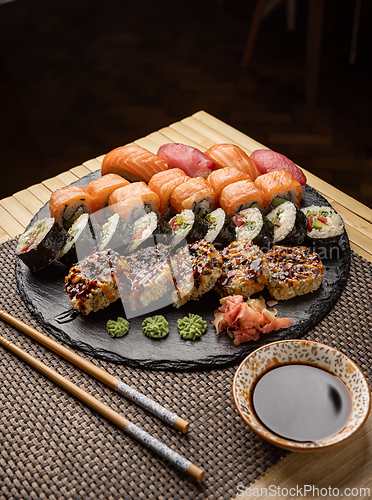 Image of Sushi set served on black slate