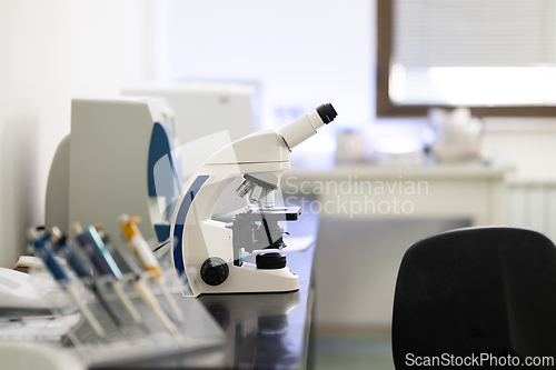 Image of Laboratory microscope on table in medical research facility