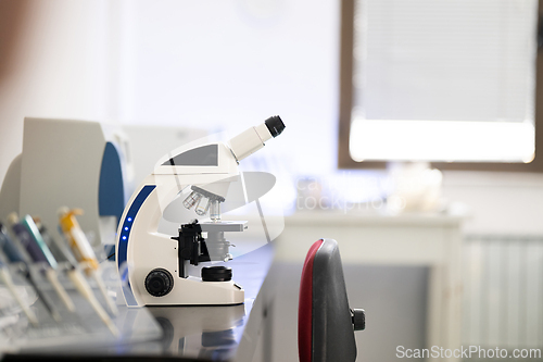 Image of Laboratory microscope on table in medical research facility