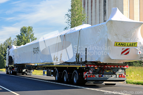Image of Long Oversize Transport on Road, Rear View