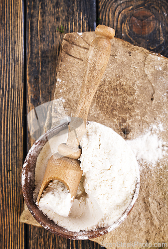 Image of Close up of bowl of flour on wooden table