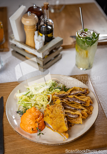Image of Breaded cutlet with salad