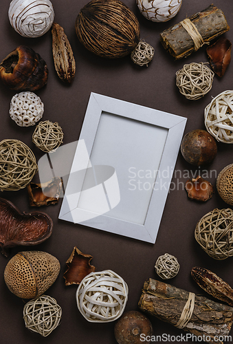 Image of Empty picture frame with pine tree and natural christmas decorat