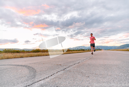 Image of Determined Athlete Running in the Sun amidst Beautiful Nature