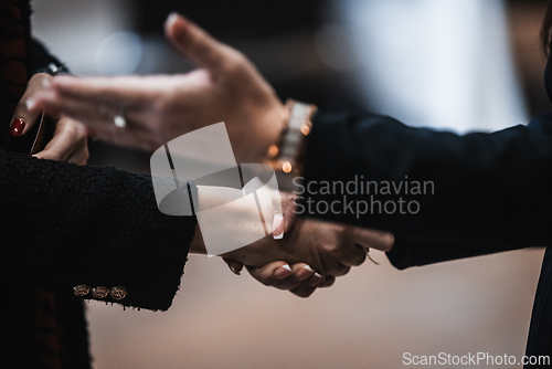 Image of Business women shaking hands. Women in business, agreement or handshake, cooperation, welcome or thank you for meeting.