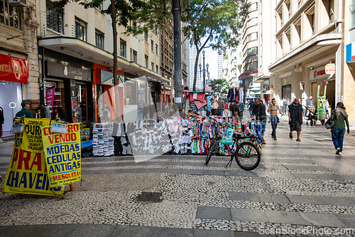 Image of Rua Barao de Itapetininga in Sao Paulo, urban scene with vendors and pedestrians on the famous shopping street. Brazil