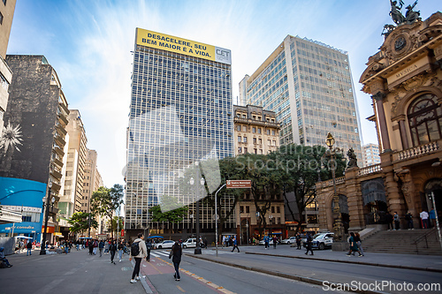 Image of People and traffic on a lively street with modern and historic buildings in Sao Paulo, Brazil.