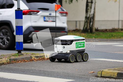 Image of Autonomous Food Delivery Robot Waiting at Zebra Crossing