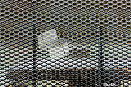 Image of Metal mesh pattern covering an interior wall in a modern buildin