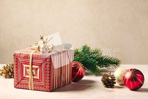 Image of beautiful Christmas Greeting card with wrapped gift box 
