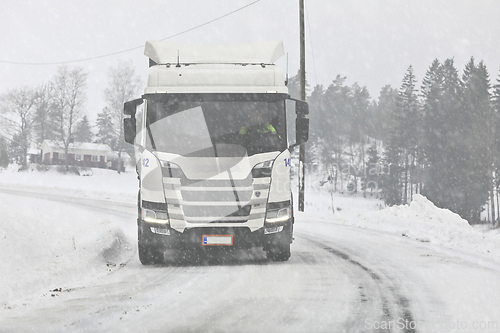 Image of White Truck Driving on Winter Road