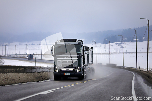 Image of Black Volvo F16 Gravel Truck in Winter Fog