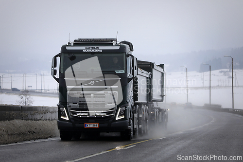 Image of Black Volvo F16 Construction Truck on Winter Road