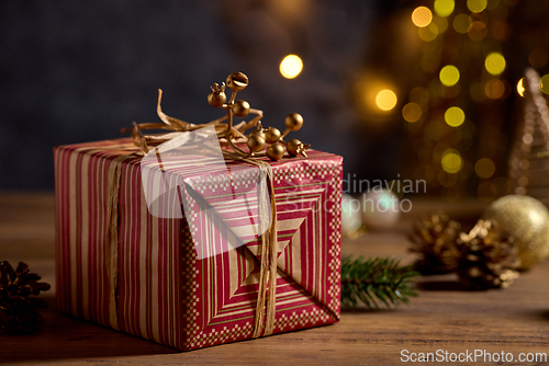 Image of beautiful Christmas Greeting card with wrapped gift box and blur