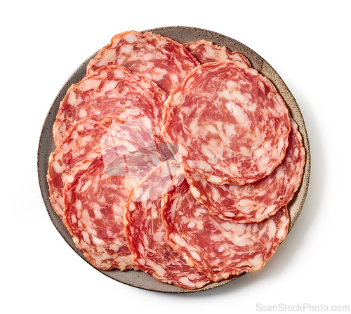 Image of plate of sliced dry spanish sausages isolated on white backgroun