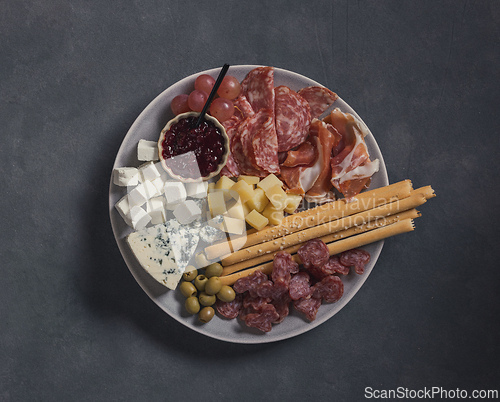 Image of set of various meat and cheese snacks