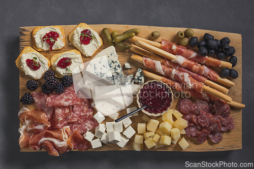 Image of set of various meat and cheese snacks
