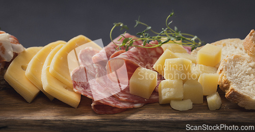 Image of set of various meat and cheese snacks