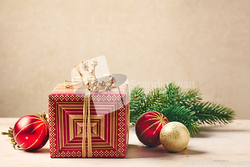 Image of beautiful Christmas Greeting card with wrapped gift box 