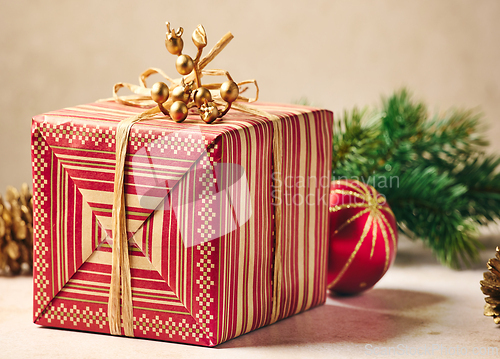 Image of beautiful Christmas Greeting card with wrapped gift box 