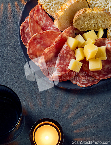 Image of plate of salami sausage and cheese