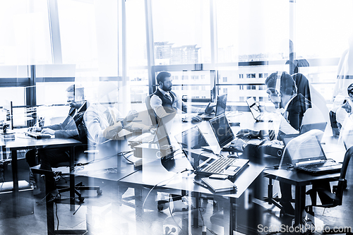 Image of Business team working in modern corporate office.