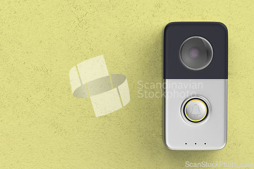 Image of Smart doorbell on yellow wall