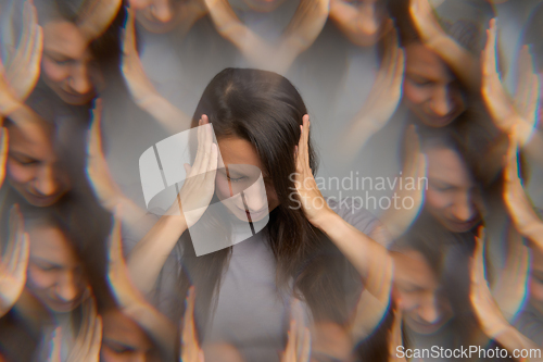 Image of Woman touching head suffering from migraine with aura and visual distortion