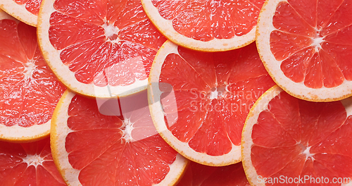 Image of closeup of ripe juicy red grapefruit fruit slices