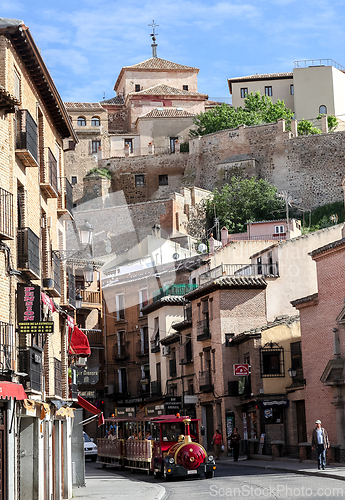Image of TOLEDO, SPAIN - MAY 06, 2015 - Tourist train on a street